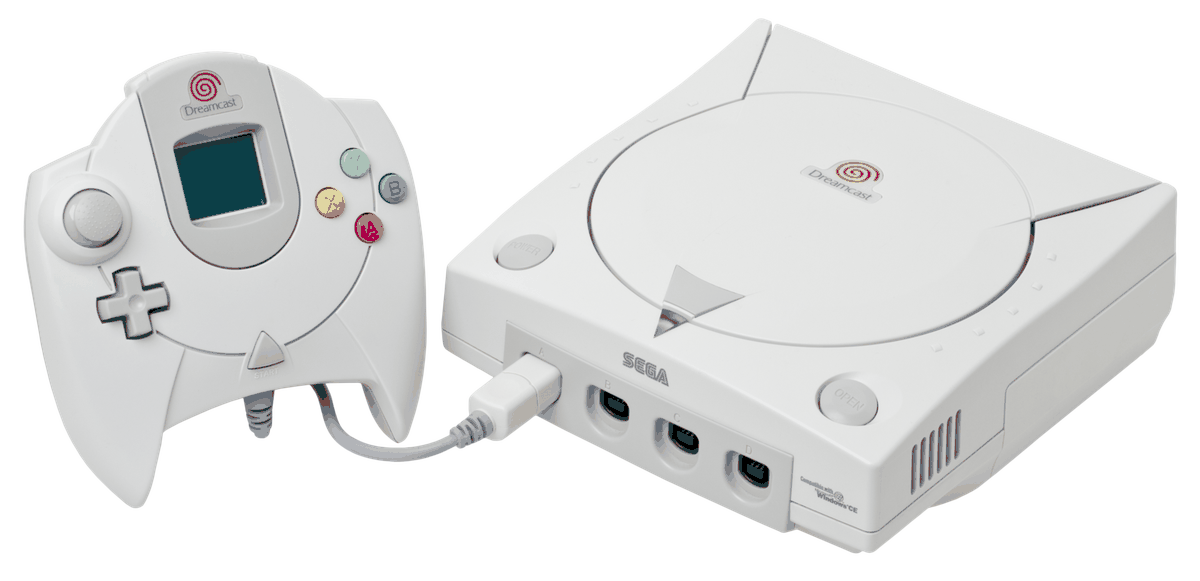 A white Sega Dreamcast console with its controller, showing the four coloured face buttons, the analogue stick and the VMU slot in the centre of the pad.