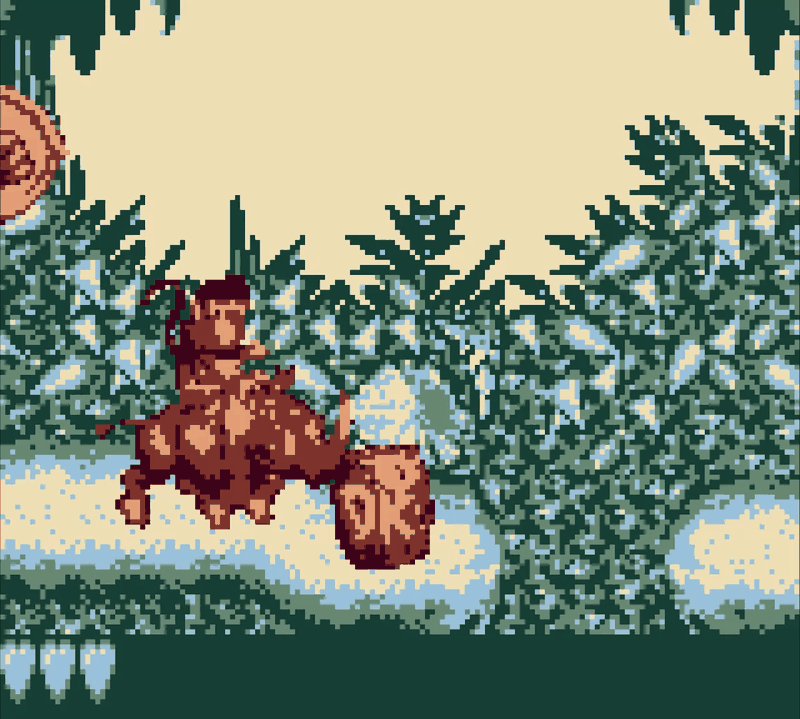 Donkey Kong riding Rambi the rhino through a jungle level, charging towards a DK barrel.