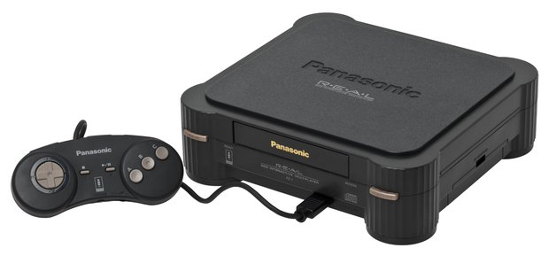 A black Panasonic FZ-1 3DO console with its controller beside it.