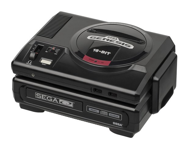 A Sega Genesis sitting on top of the first-model Sega CD, the two stacked into one black slab.