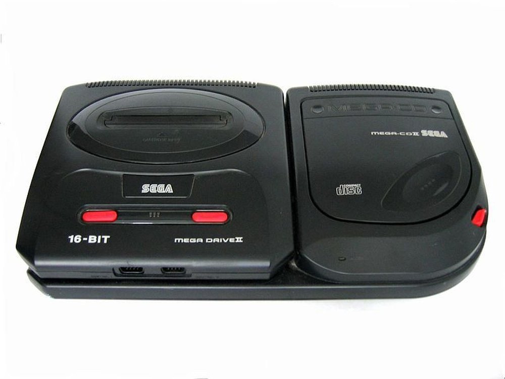 A black Mega Drive II sitting alongside a Mega CD II, the two units clipped together side by side.