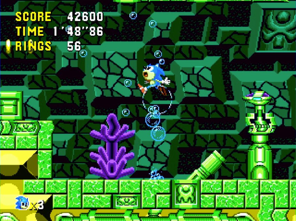 Sonic mid-air in a green stone interior zone of Sonic CD, surrounded by bubbles, with 56 rings collected.