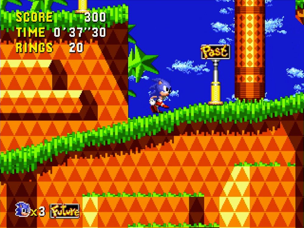Sonic running past a signpost marked Past in Palmtree Panic, with a Future indicator showing at the bottom of the screen.