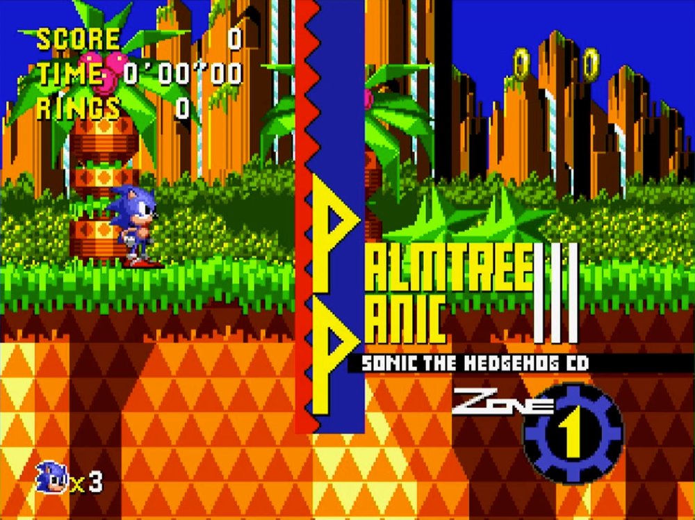 The Palmtree Panic Zone 1 title card in Sonic CD, with Sonic standing on green grass against orange rock formations and palm trees.