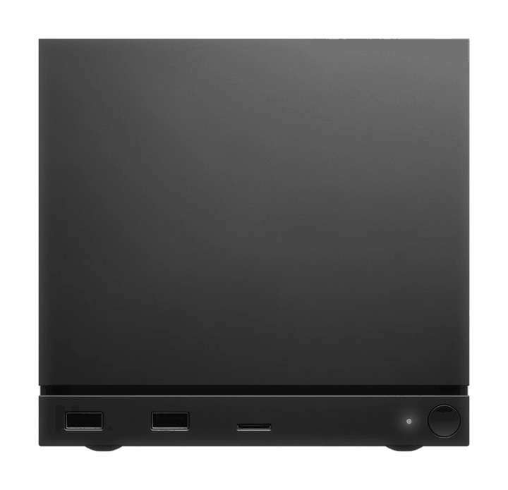 Valve's Steam Machine, a small cube-shaped console, seen from the front with two USB ports, an SD card slot and a power button.