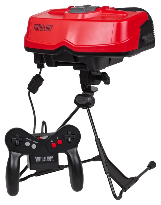 A Nintendo Virtual Boy: a red visor unit mounted on a black folding stand, with its black two-handed controller on a cable below.